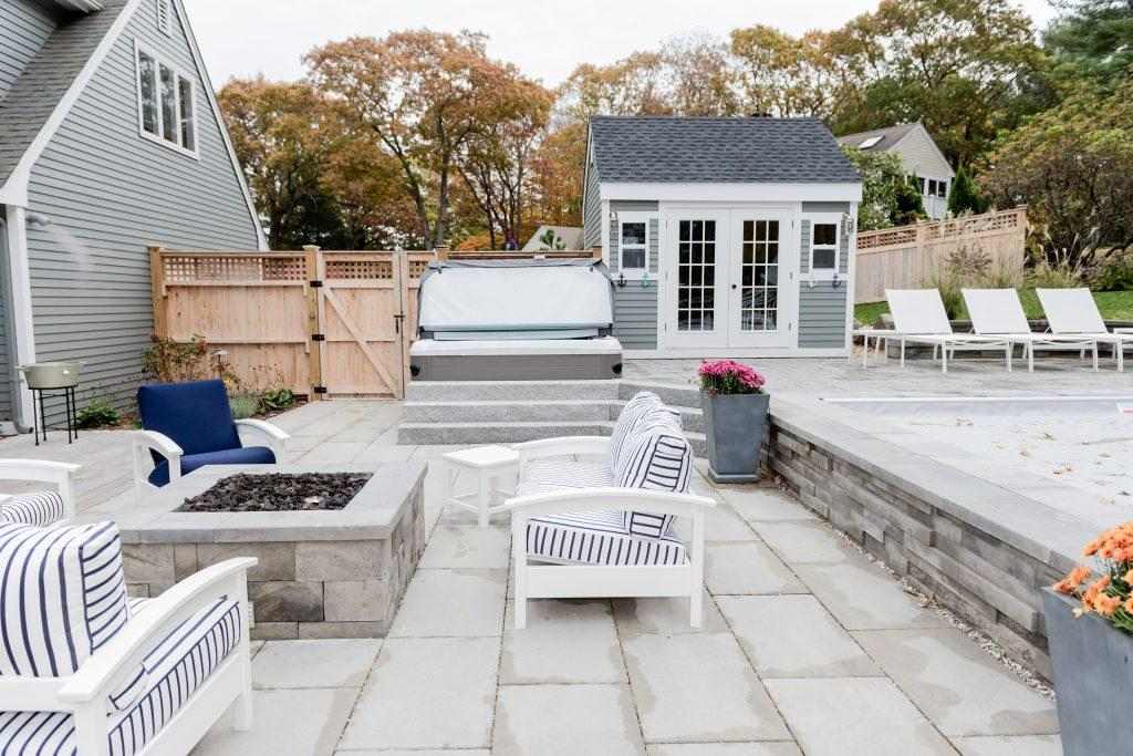 custom square stone fire pit on a patio