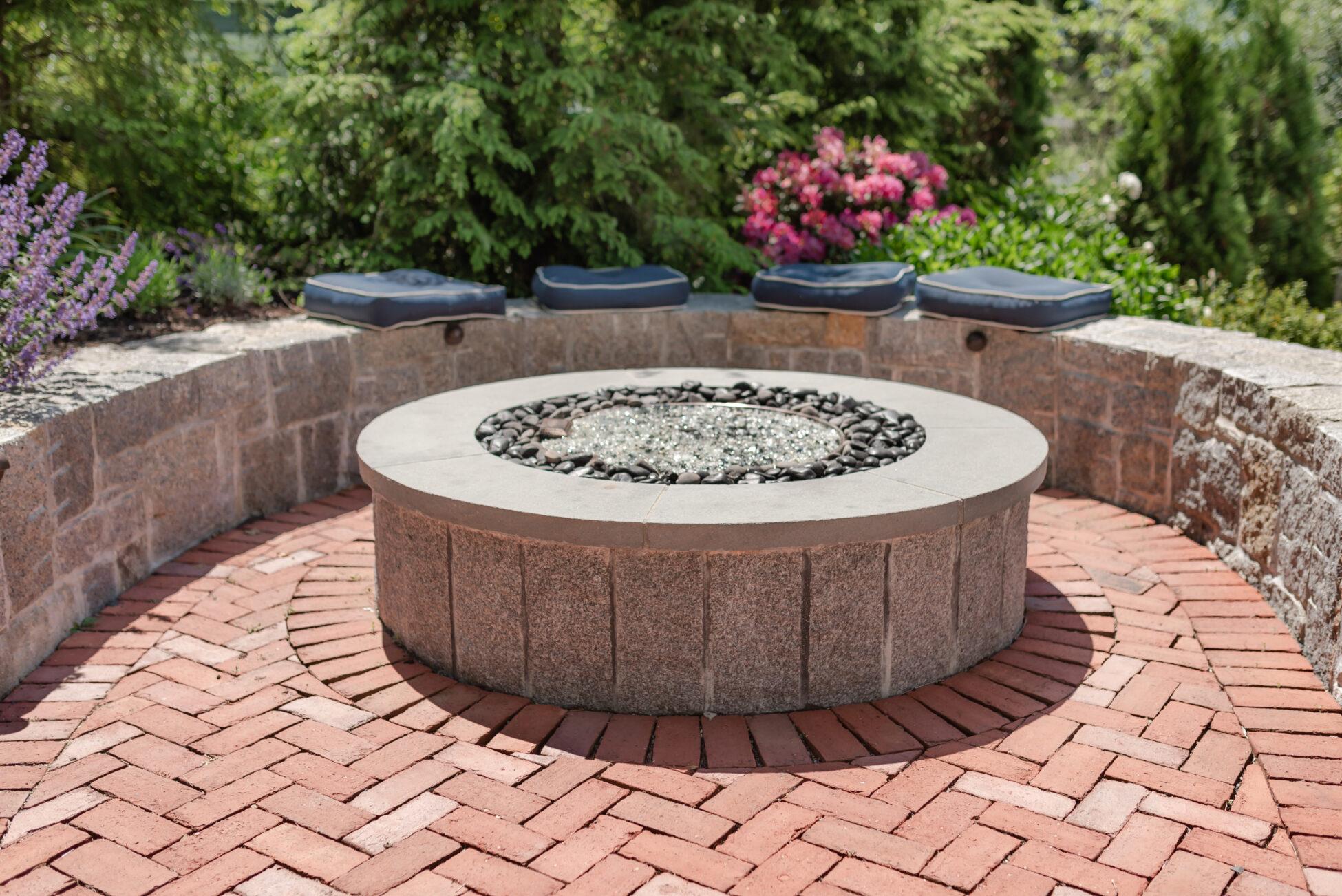 Paved patio with stone firepit